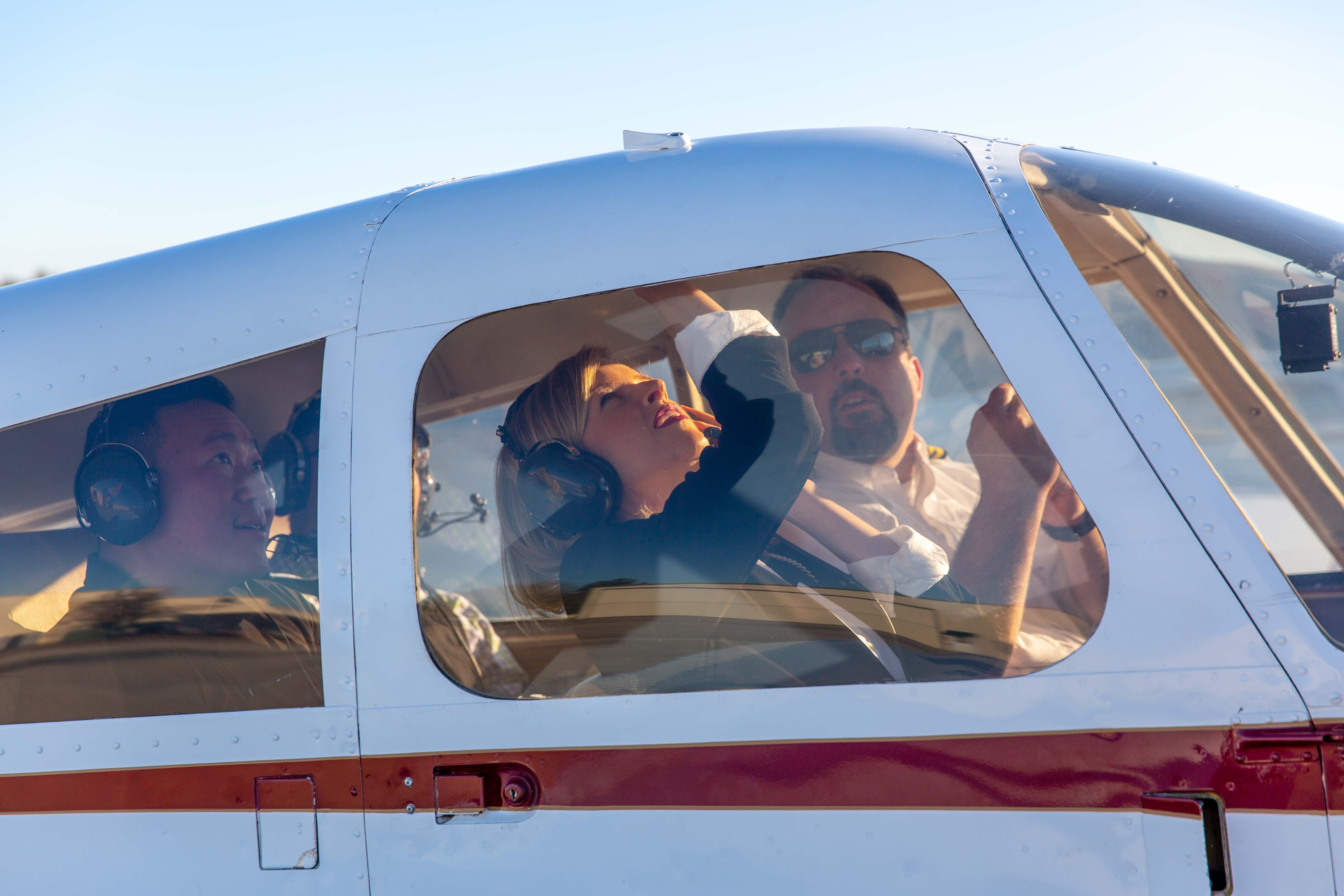Prospective student pilot seated in a training aircraft during a discovery flight
